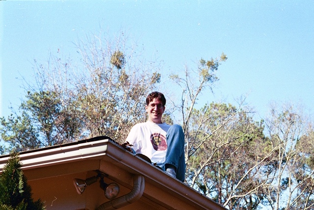 Christopher Schmitt on a roof looking down in 2001