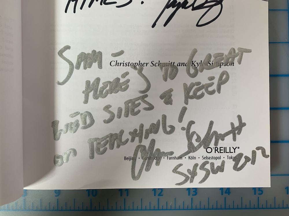 Christopher signed a copy of HTML5 cookbook for Sam. It reads "Sam - here's to great RWD (Responsive Web Design) sites and keep on Teaching. - Chris SXSW 2012"