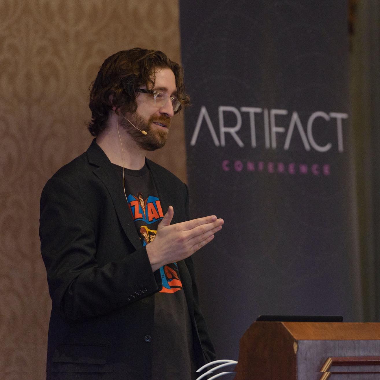 Christopher with speaking microphone on at Artifact Conf